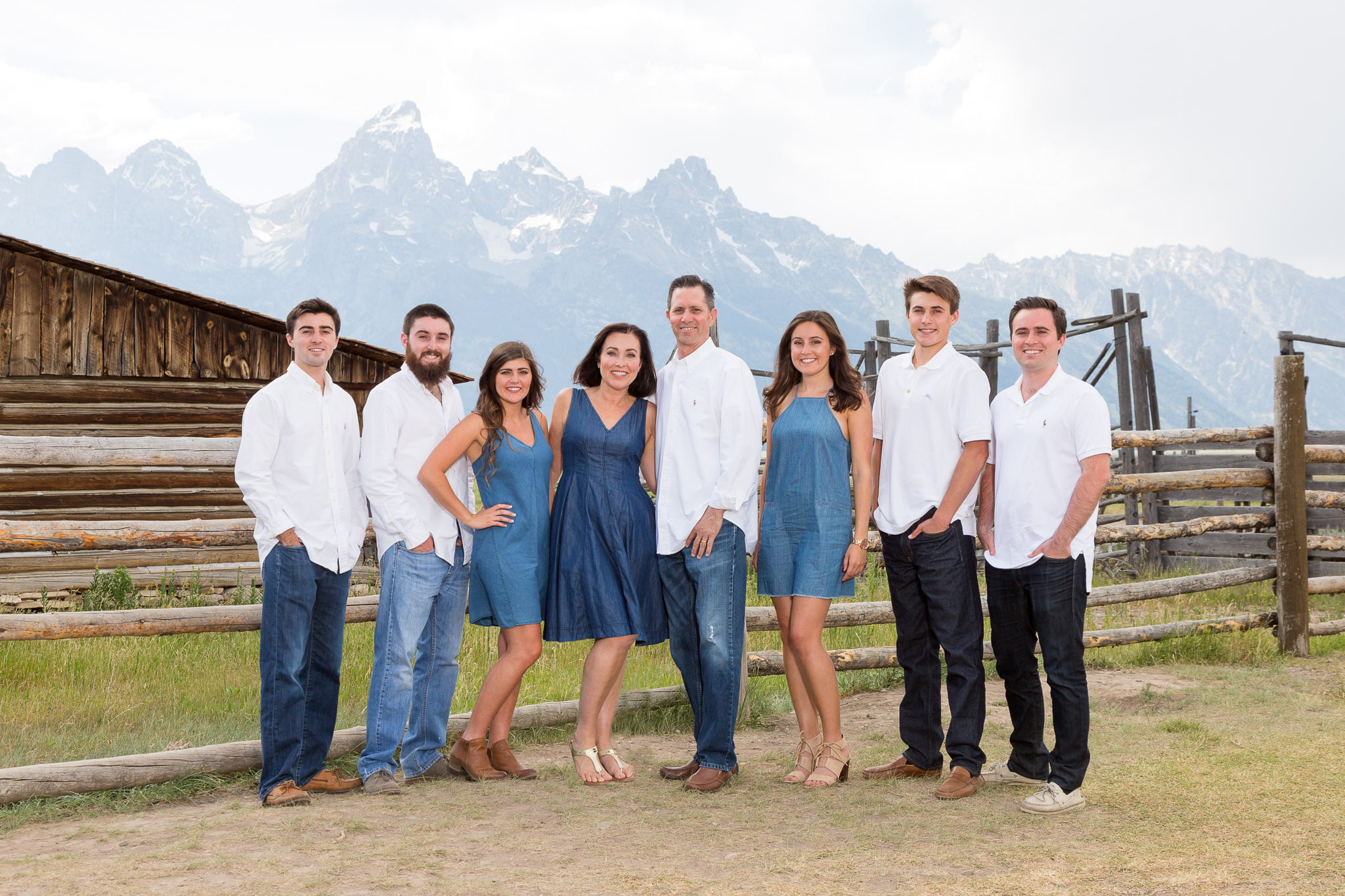 A family portrait of 8 people at Moulton Barn in Grand Teton National Park