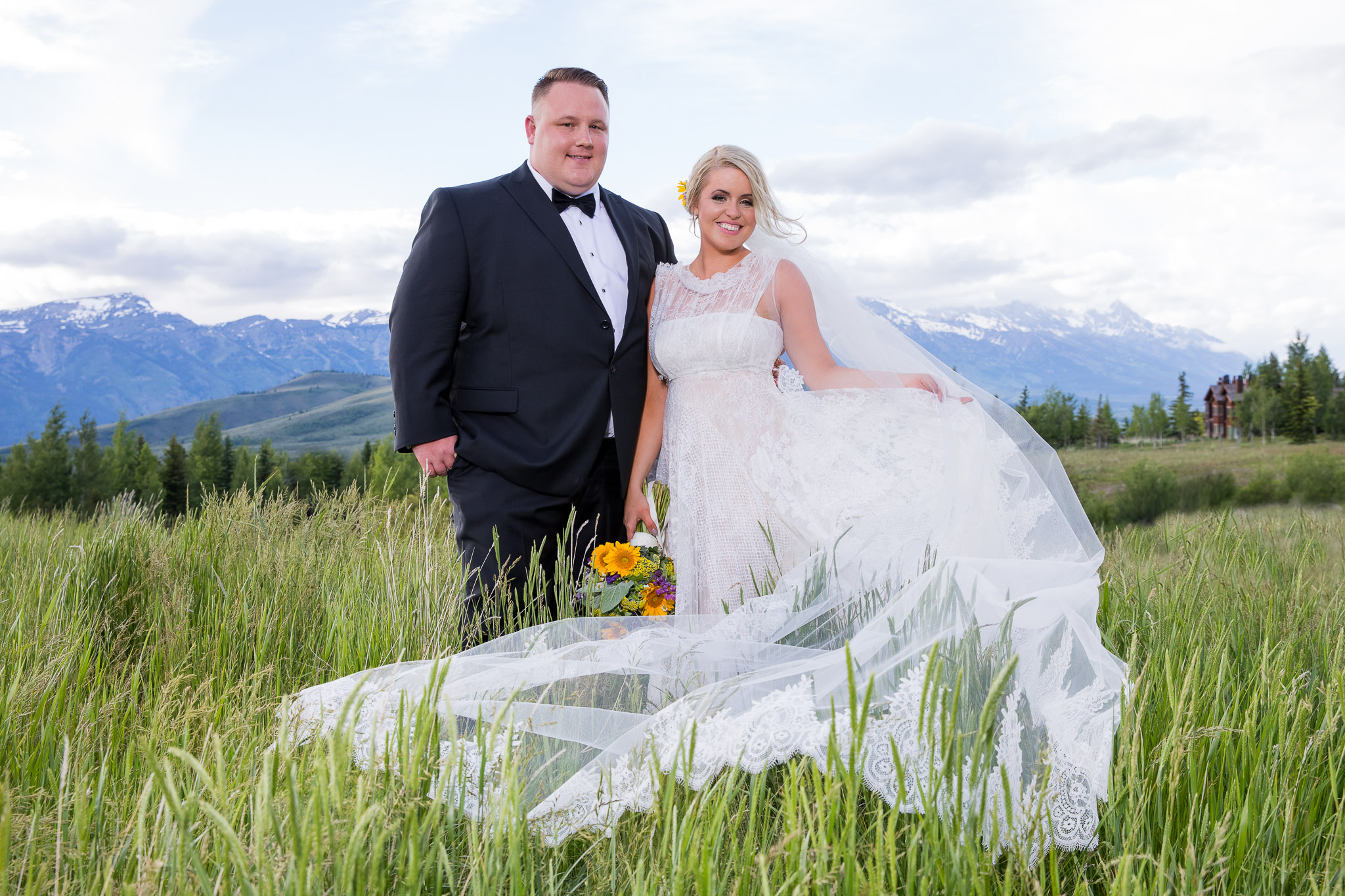 A groom and bride in front of the mountains in Jackson Hole Wyoming