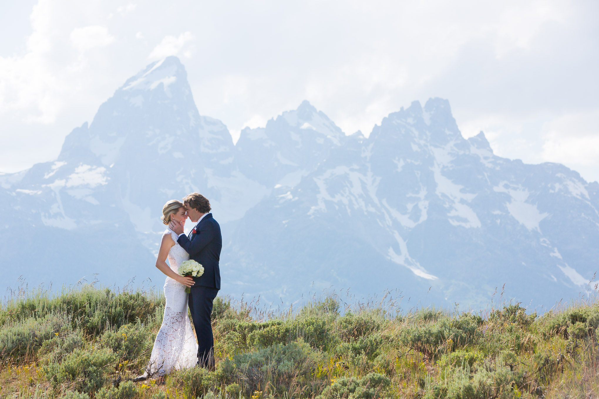 A married couple under the Grand Teton in Jackson Hole, Wyoming